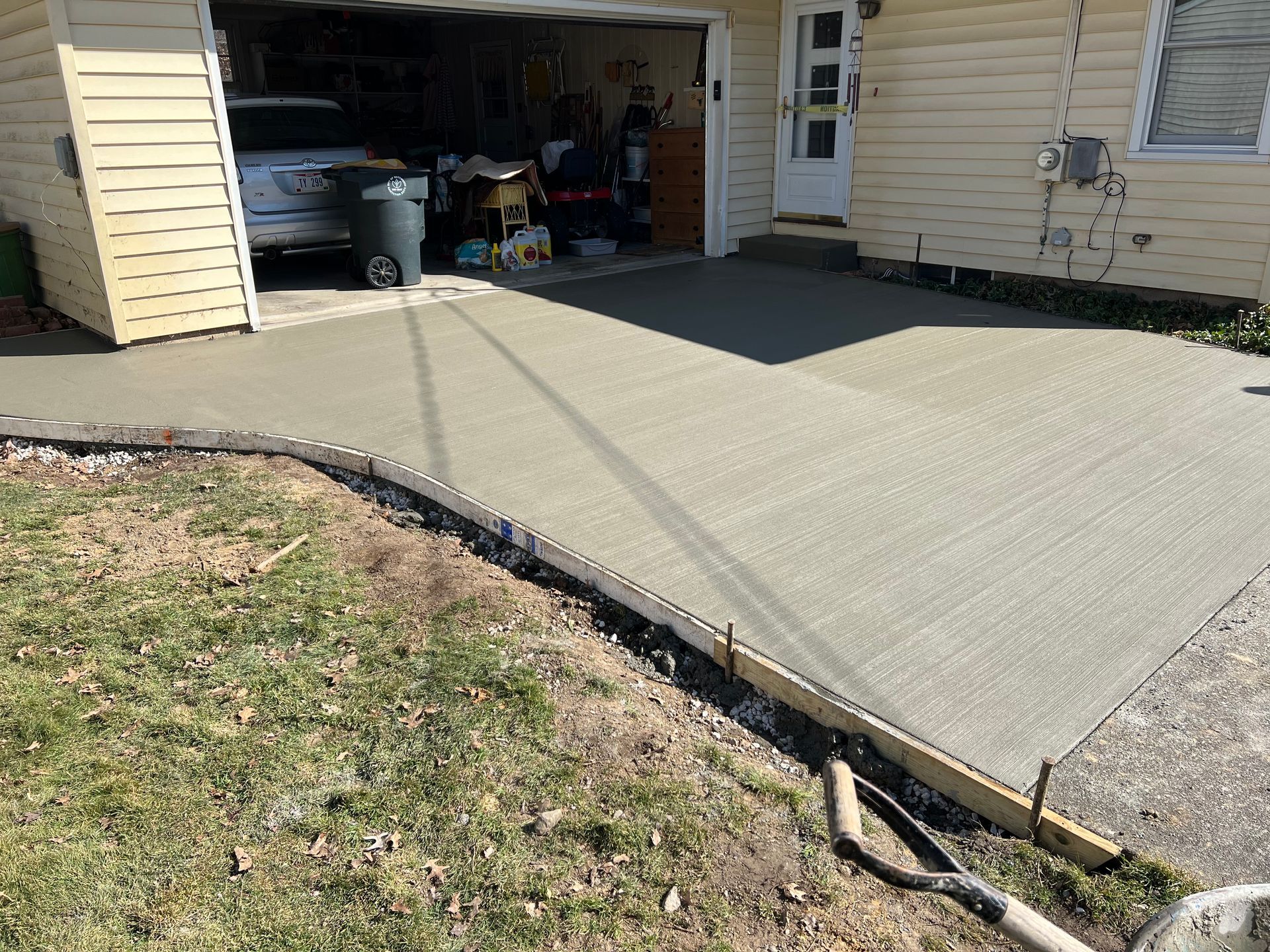 Broom-finished concrete driveway