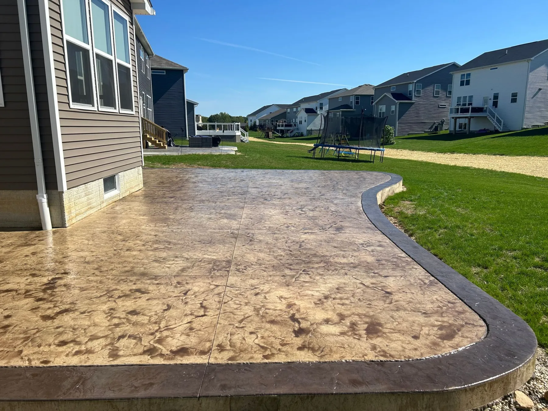 Stamped concrete patio with decorative border by Kelley Concrete and Construction